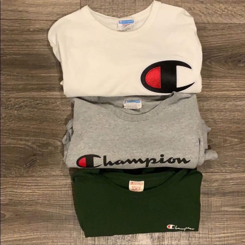 (3) Champions shirts different colors and design.